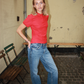 Ulrikka is 176 cm tall and wears size XS women fit | women red